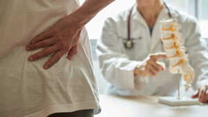 Concept of backpain patient visiting doctor in clinic